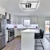 A modern kitchen with a stainless steel refrigerator, stove, cabinets, and an island with bar stools. Náhľad obrázku produktu