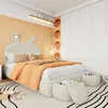 A child's bedroom with a bed, wardrobe, and decorative elements. Anteprima dell’immagine prodotto
