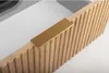 A close-up view of a wooden cabinet drawer with a gold handle. Voir les images du produit