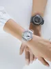 Two people's arms are crossed, each wearing a different Casio G-Shock watch. Voir les images du produit