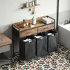 A bathroom scene featuring a laundry cart with drawers and multiple laundry bags, next to a bathtub. Produktbild-Vorschau