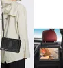 A person wearing a tablet case with a strap, and a tablet mounted on a car seat headrest. Produktbild-Vorschau