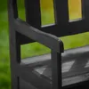 A close-up view of a dark wooden garden bench with a blurred green background. Anteprima dell’immagine prodotto