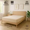 A bed with a beige fitted sheet in a bedroom setting. Produktbild-Vorschau