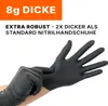 A person putting on black nitrile gloves. Produktbild-Vorschau