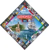A diamond-shaped Monopoly board for the city of Kiel, Germany, featuring images of local landmarks and a large sailing ship. Produktbild-Vorschau
