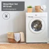 A washing machine and laundry basket in a laundry room setting. Produktbild-Vorschau
