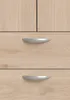 A close-up view of two drawers with handles on a wooden cabinet. Produktbild-Vorschau