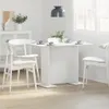 A white dining table set with white chairs in a bright, modern room. Anteprima dell’immagine prodotto