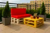 A balcony setting with outdoor furniture and drinks. Produktbild-Vorschau