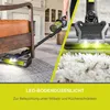 A split image showing a person using a cordless vacuum cleaner under furniture on the left, and a close-up of the vacuum head on a rug on the right. Text overlays describe a feature. Produktbild-Vorschau
