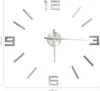 A 3D wall clock with silver numbers and hands on a white background. Náhľad obrázku produktu