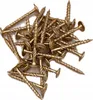 A pile of gold-colored screws on a white background. Náhled obrázku produktu