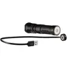 A black LED flashlight with a USB charging cable and magnetic charging adapter. Produktbild-Vorschau