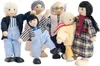 A group of six wooden dolls arranged together against a white background. Náhľad obrázku produktu