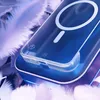 A close-up of a blue phone case with a MagSafe ring, resting on a bed of white and purple feathers. Náhled obrázku produktu