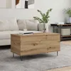 A living room scene with a couch, coffee table, and shelving unit. Voir les images du produit