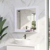 A bathroom scene with a mirror, sink, and faucet. Produktbild-Vorschau