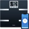 A black digital scale and a smartphone displaying health data. Produktbild-Vorschau
