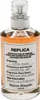 A clear, well-lit studio shot of a bottle of Maison Margiela Replica Coffee Break Eau de Toilette. Produktbild-Vorschau