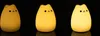 Three illuminated cat-shaped night lights are displayed against a black background. Produktbild-Vorschau
