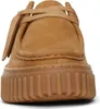 A close-up, front-facing view of a brown suede shoe with a thick, ribbed sole. Náhľad obrázku produktu
