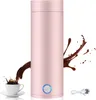 A pink electric kettle with a cup of coffee splashing into it and a power cord. Produktbild-Vorschau