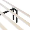 A close-up view of a bed frame's wooden slats and black metal support structure. Produktbild-Vorschau