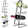 Three views of a black metal wine rack holding wine bottles, presented on a white background. Anteprima dell’immagine prodotto