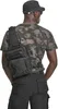 A person wearing a camouflage t-shirt and black cargo pants, carrying a black shoulder bag. Produktbild-Vorschau