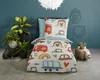 A child's duvet cover with a car theme is displayed on a bed in a room setting. Anteprima dell’immagine prodotto