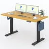 A wooden standing desk with two monitors, a keyboard, a mouse, a cup of coffee, headphones, and a bag hanging from the side. Produktbild-Vorschau