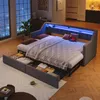A bedroom scene with a sofa bed converted into a bed, showcasing storage drawers and LED lighting. Náhled obrázku produktu