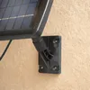 A close-up view of a solar panel mount attached to a textured wall. Produktbild-Vorschau