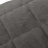 A close-up view of a quilted grey fabric, likely a weighted blanket. Náhľad obrázku produktu