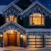 A house decorated with icicle lights for Christmas. Anteprima dell’immagine prodotto