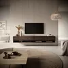 A modern living room scene with a wall-mounted TV stand and a television. Anteprima dell’immagine prodotto