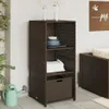 An outdoor storage cabinet with shelves and a basket, placed on a patio next to a watering can. Náhled obrázku produktu