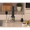 A kitchen counter with a hand blender and its accessories, along with ingredients for making a sauce or dip. Anteprima dell’immagine prodotto
