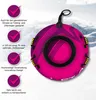 A pink snow tube is shown against a snowy mountain background with text overlays describing its features. Produktbild-Vorschau
