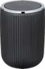 A black trash can with a ribbed texture and a silver rim. Produktbild-Vorschau