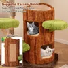 A cat tree designed to look like a tree trunk with two openings for cats, featuring green platforms and a sisal scratching board. Anteprima dell’immagine prodotto