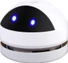 A white mini desktop vacuum cleaner with blue glowing eyes. Produktbild-Vorschau