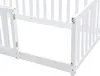 Close-up of a white wooden baby crib or bed frame, showing the corner with a hinged gate. Náhled obrázku produktu