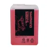 A bottle of red Shimano hydraulic mineral oil for bicycle disc brakes. Produktbild-Vorschau