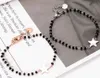 Bracelet en acier chirurgical avec perles noires Star Voir les images du produit 9