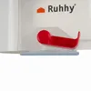 A close-up view of a red handle and part of a white container with a logo and text. Produktbild-Vorschau