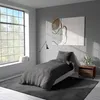 A bedroom scene with a bed, window, and artwork. Produktbild-Vorschau