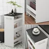 A collage of images showing a slim rolling storage cart with a black top, filled with bathroom and kitchen items. The cart is shown in different settings, including next to a toilet and on a tiled floor. Voir les images du produit