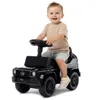 A baby is riding a black toy Mercedes-Benz G-Class car. Produktbild-Vorschau